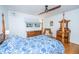 Bright bedroom featuring a four-poster bed, hardwood floors, and ample natural light, creating a cozy atmosphere at 112 Furlong Rd, Summerville, SC 29483