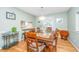 Inviting dining room with hardwood floors, a stylish chandelier, and comfortable seating at 112 Furlong Rd, Summerville, SC 29483