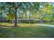 Charming single-story home with a classic front exterior, manicured lawn, and a carport with a basketball hoop at 112 Furlong Rd, Summerville, SC 29483