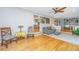 Open living room with hardwood floors and views to the kitchen and office area at 112 Furlong Rd, Summerville, SC 29483