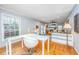 Open-concept office boasts hardwood floors and views into the living room at 112 Furlong Rd, Summerville, SC 29483