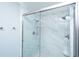Elegant bathroom with a glass enclosed shower featuring stylish fixtures and white marble tiling at 112 Furlong Rd, Summerville, SC 29483
