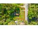 Aerial view of property with boundary line, showcasing the home, yard, and surrounding landscape at 11341 Cottageville Hwy, Cottageville, SC 29435