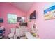 Pink bathroom featuring a vanity with a mirror, a toilet, and a window for natural light at 11341 Cottageville Hwy, Cottageville, SC 29435