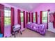 Cozy bedroom featuring bright pink walls, ample natural light, and a charming, playful decor at 11341 Cottageville Hwy, Cottageville, SC 29435
