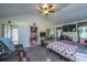 Cozy bedroom with ceiling fan, closet, desk, tv and open door to another room at 11341 Cottageville Hwy, Cottageville, SC 29435
