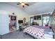 Bright bedroom featuring two beds, TV, desk, and adjoining room with an open door at 11341 Cottageville Hwy, Cottageville, SC 29435