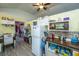 Compact kitchen with a wood breakfast bar, white appliances, and ample overhead storage at 11341 Cottageville Hwy, Cottageville, SC 29435