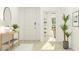 Welcoming foyer with light wood floors, a decorative table, and open doorway at 1157 Darling St, Summerville, SC 29485