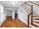 Inviting foyer with hardwood floors, staircase, and views into the living areas at 12 Trail Hollow Ct, Charleston, SC 29414