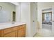 Bathroom featuring wood cabinets, a tile floor, and an entryway to the bedroom at 1215 Dingle Rd, Mount Pleasant, SC 29466
