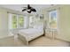 Inviting bedroom with a queen-sized bed, ceiling fan, and natural light from the windows at 1215 Dingle Rd, Mount Pleasant, SC 29466