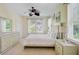 Bright bedroom featuring stylish furnishings, including a dresser, nightstand, and decorative lamps at 1215 Dingle Rd, Mount Pleasant, SC 29466