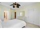 Neutral bedroom with a queen bed, dresser, and multiple entryways for convenient access to other areas at 1215 Dingle Rd, Mount Pleasant, SC 29466