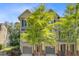 Charming townhome with attached garage, lush landscaping, and a inviting front entrance at 1215 Dingle Rd, Mount Pleasant, SC 29466
