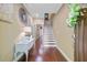 Hallway with hardwood floors, staircase, decorative lighting, and an inviting atmosphere at 1215 Dingle Rd, Mount Pleasant, SC 29466