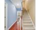 Spacious hallway with hardwood floors leading to a carpeted staircase at 1215 Dingle Rd, Mount Pleasant, SC 29466