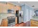 Well-equipped kitchen with stainless steel appliances, ample cabinet space, and hardwood floors at 1215 Dingle Rd, Mount Pleasant, SC 29466