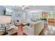 Open-concept living room with hardwood floors, fireplace, and ample natural light at 1215 Dingle Rd, Mount Pleasant, SC 29466
