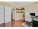 Home office showcasing hardwood floors, open shelving, and a comfortable desk chair at 1215 Dingle Rd, Mount Pleasant, SC 29466