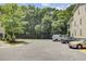 Paved parking area featuring several vehicles, a fire hydrant and trees at 1215 Dingle Rd, Mount Pleasant, SC 29466