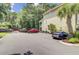 Paved parking area featuring a palm tree and parking for several vehicles at 1215 Dingle Rd, Mount Pleasant, SC 29466