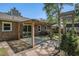 Brick home with wood pergola, mature landscaping, and stone paver patio at 122 William St, Summerville, SC 29486