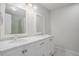 Bright bathroom featuring a dual sink vanity with granite countertop and an updated shower at 122 William St, Summerville, SC 29486