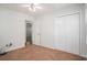 Neutral bedroom with ceiling fan, carpet flooring, and two closets, one leading into another room at 122 William St, Summerville, SC 29486