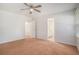 Neutral bedroom with ceiling fan, two closets, warm carpeting, and access to a bathroom at 122 William St, Summerville, SC 29486