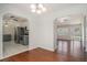 Dining area with hardwood floors offering views of the kitchen and living room at 122 William St, Summerville, SC 29486