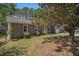 Lovely brick home with a lush front yard and mature tree, creating shade at 122 William St, Summerville, SC 29486