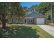 Charming brick home features a well-manicured lawn and inviting front entrance at 122 William St, Summerville, SC 29486