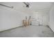 A well lit garage features a washer/dryer, utility sink, table, and garage door opener at 122 William St, Summerville, SC 29486