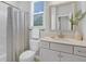 Bathroom with a white vanity, mirror, and shower/tub combination at 123 Brown Swiss Cir, Summerville, SC 29483