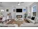 Bright living space with a fireplace, lots of natural light, and comfortable seating at 123 Brown Swiss Cir, Summerville, SC 29483