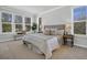 Bright and airy bedroom featuring multiple windows, neutral décor, and stylish furnishings at 123 Brown Swiss Cir, Summerville, SC 29483