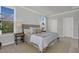 A neutral main bedroom featuring two windows and modern bedside tables at 123 Brown Swiss Cir, Summerville, SC 29483