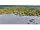 Scenic aerial view of a waterfront property surrounded by lush greenery and a tranquil bay at 1239 Old Orchard Rd, Charleston, SC 29412