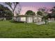 Back exterior of house, showing fenced area and large, green backyard at 1239 Old Orchard Rd, Charleston, SC 29412