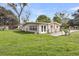 Back exterior of house, showing fenced area and large, green backyard at 1239 Old Orchard Rd, Charleston, SC 29412