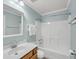 Bathroom with a vanity, toilet, bathtub and shower with white tile surround at 1239 Old Orchard Rd, Charleston, SC 29412