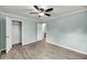Bedroom featuring a ceiling fan, a closet and light gray wood floors at 1239 Old Orchard Rd, Charleston, SC 29412