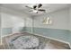 Spacious bedroom with an area rug and a ceiling fan and fresh paint at 1239 Old Orchard Rd, Charleston, SC 29412