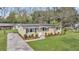 Well-maintained home with manicured lawn, a stately palm, and a welcoming entrance at 1239 Old Orchard Rd, Charleston, SC 29412