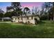 Well-kept home with a beautifully landscaped lawn, flowering shrubs, and inviting curb appeal at 1239 Old Orchard Rd, Charleston, SC 29412
