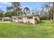 Well-kept home with a beautifully landscaped lawn, flowering shrubs, and inviting curb appeal at 1239 Old Orchard Rd, Charleston, SC 29412