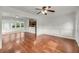 Hardwood floors and crisp white walls, open-concept design offering views to dining and kitchen areas at 1239 Old Orchard Rd, Charleston, SC 29412