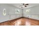 Bright living room showcasing hardwood floors, chair rail molding and an oval glass front door at 1239 Old Orchard Rd, Charleston, SC 29412