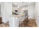 Charming kitchen with granite countertops, island with seating, and stainless steel appliances at 125 Brown Swiss Cir, Summerville, SC 29483